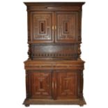 A Jacobean style carved oak cupboard,