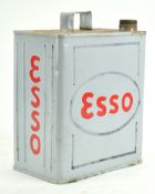 A metal Esso motor spirit can, finished in grey, cap deficient,