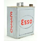 A metal Esso motor spirit can, finished in grey, cap deficient,
