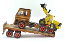 A wooden toy lorry and trailer,