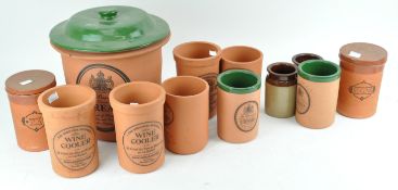 A collection of terracotta kitchen containers,