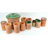 A collection of terracotta kitchen containers,