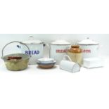 An assortment of kitchenalia, including enamel flour and bread bins,