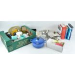 A collection of kitchenware and books,