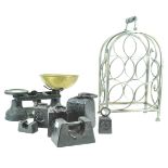 A set of cast Salter iron and brass kitchen scales with a large group of weights and a metal wine