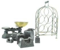 A set of cast Salter iron and brass kitchen scales with a large group of weights and a metal wine