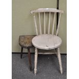 A painted stickback chair and a stool with tripod legs