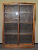 An oak glazed cabinet,