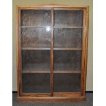 An oak glazed cabinet,