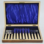 A boxed set of fish knives and forks
