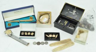 A collection of assorted costume jewellery to include gold plated cuff links, coins,