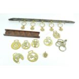A collection of horse brasses, swingers,