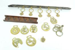 A collection of horse brasses, swingers,