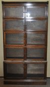 An oak five tier glazed bookcase