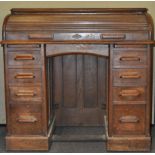 An oak roll top desk,