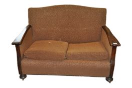A two seater sofa with oak frame,