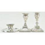 A pair of silver candlesticks,