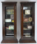 Two vintage display cabinets with a collection of packaging,