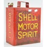 A metal Shell motor spirit can with brass cap, finished in red,