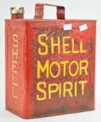 A metal Shell motor spirit can with brass cap, finished in red,