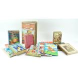 A box of Annuals and children's books