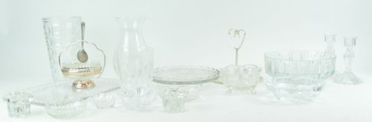 A pair of moulded glass candlesticks,