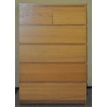 A wood effect chest of two short and four long drawers,