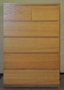 A wood effect chest of two short and four long drawers,