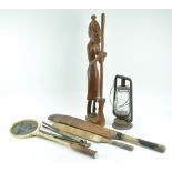 An African carved hardwood figure of a woman pounding maize,