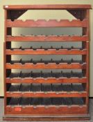 A stained pine wine rack,