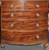 A George IV mahogany bow fronted chest of two short and thee long drawers,