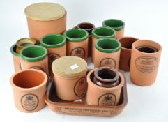 A collection of terracotta kitchen containers,