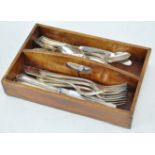 A wooden cutlery box and cutlery