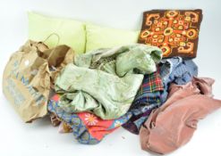 A group of assorted fabrics and cushions