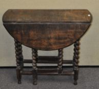 An oak barley twist table,