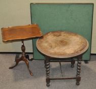 A folding card table and two others