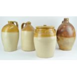 A collection of stoneware cider jars and other stoneware