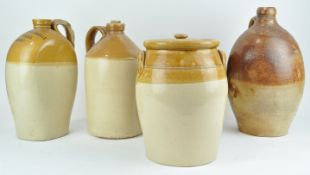 A collection of stoneware cider jars and other stoneware