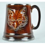 A Sylvac mug, moulded with a fox mask, impressed marks 2376, and original paper label,