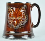 A Sylvac mug, moulded with a fox mask, impressed marks 2376, and original paper label,