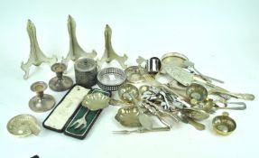 A silver plated candlestick and other items
