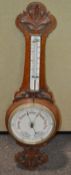 A 19th century carved oak barometer