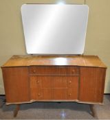 A 1950's mahogany dressing table with mirrored back