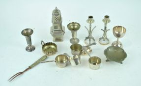 A silver plated sugar sifter and other items