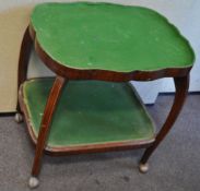 An early 20th century inlaid mahogany trolley with two tiers, felted,