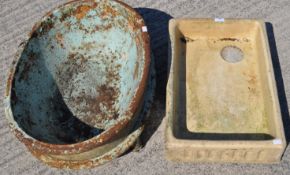 A child's vintage metal bath and ceramic squared sink