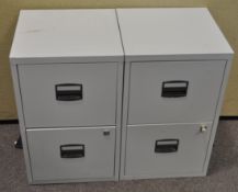 A pair of metal filing cabinets