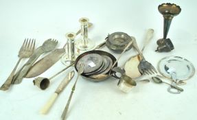 A silver plated candlestick and other items
