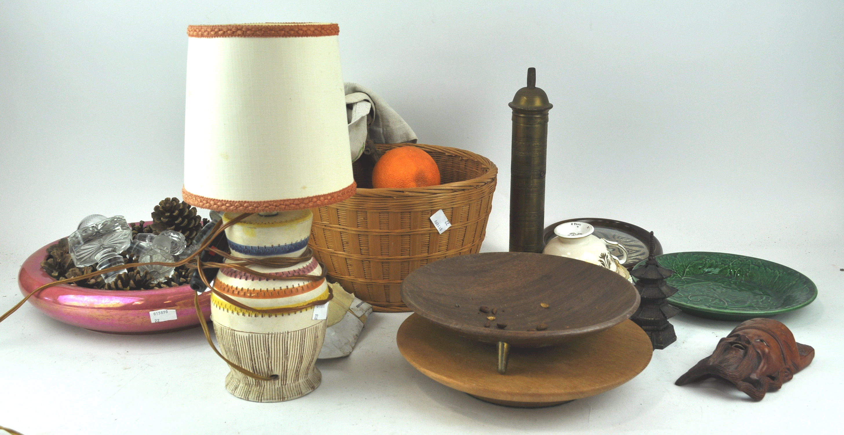 A basket containing imitation fruit and other items