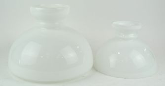 A pair of large and medium white 'Aladdin' oil lamp shades,